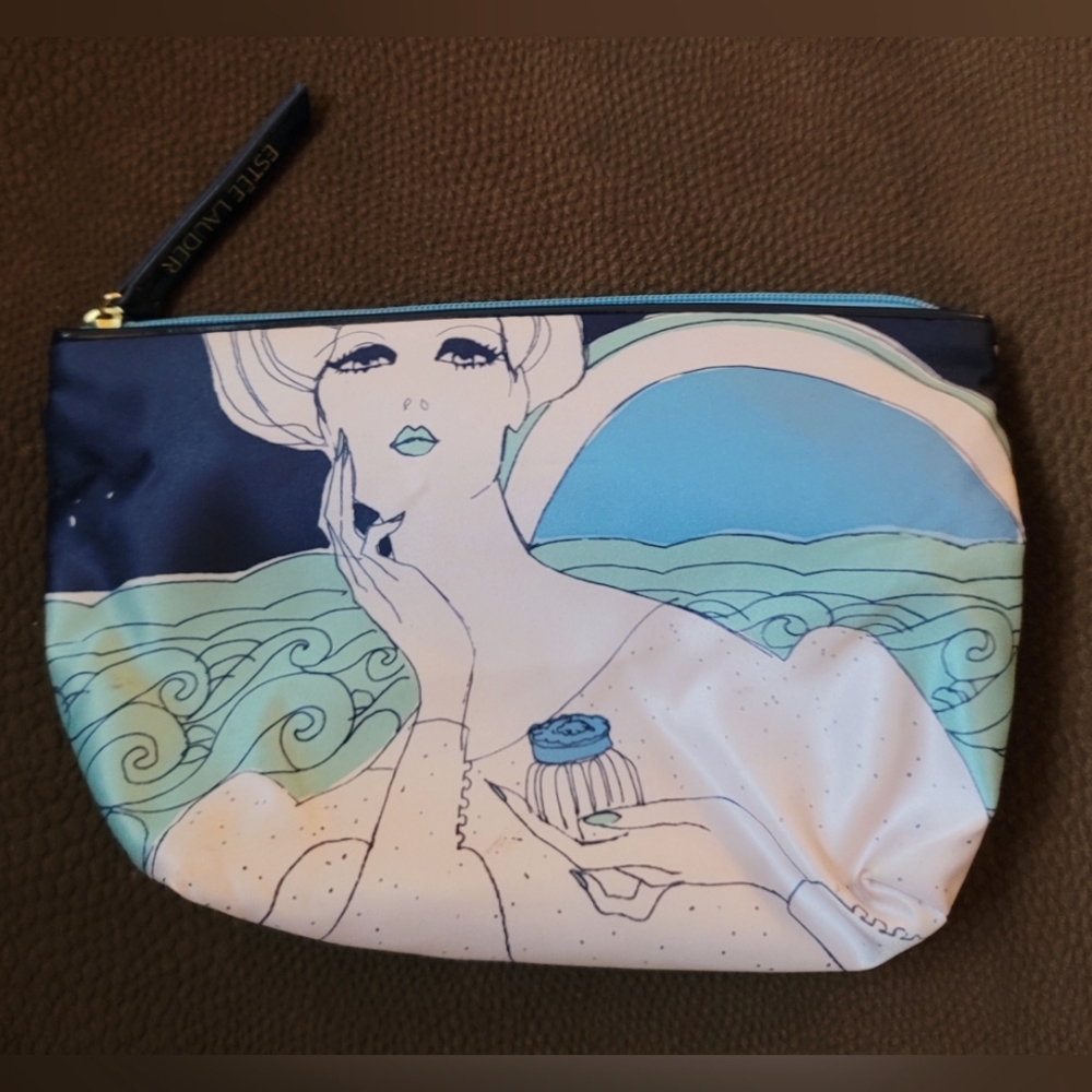 Estee Lauder small blue makeup bag.